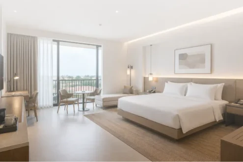 Modern 4-star hospitality interior featuring custom hotel furniture, FF&E procurement, interior styling, and hospitality project solutions by Le Savara. The room showcases contemporary hotel design with minimalist furnishings, premium material finishes, integrated lighting, guest-focused spatial planning, and functional hospitality furniture suitable for hotels, resorts, villas, and commercial accommodation projects. Le Savara provides end-to-end hospitality solutions including interior design, furniture procurement, custom manufacturing, and FF&E project management.
