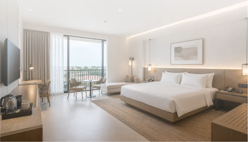 Modern 4-star hospitality interior featuring custom hotel furniture, FF&E procurement, interior styling, and hospitality project solutions by Le Savara. The room showcases contemporary hotel design with minimalist furnishings, premium material finishes, integrated lighting, guest-focused spatial planning, and functional hospitality furniture suitable for hotels, resorts, villas, and commercial accommodation projects. Le Savara provides end-to-end hospitality solutions including interior design, furniture procurement, custom manufacturing, and FF&E project management.
